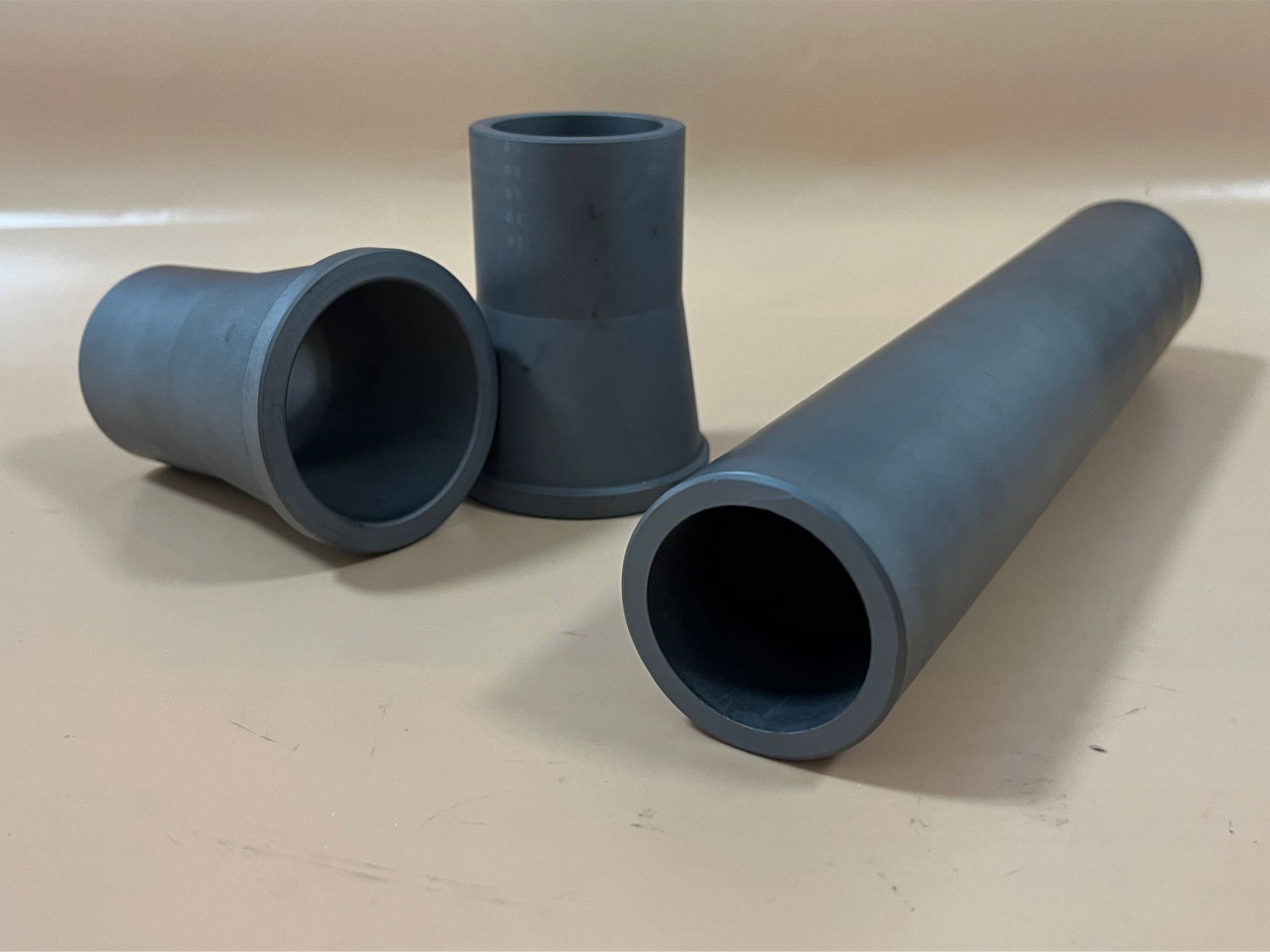 Wear and corrosion resistant ceramic reducer/nozzle/cyclone sleeve and tube in alpha sintered silicon carbide