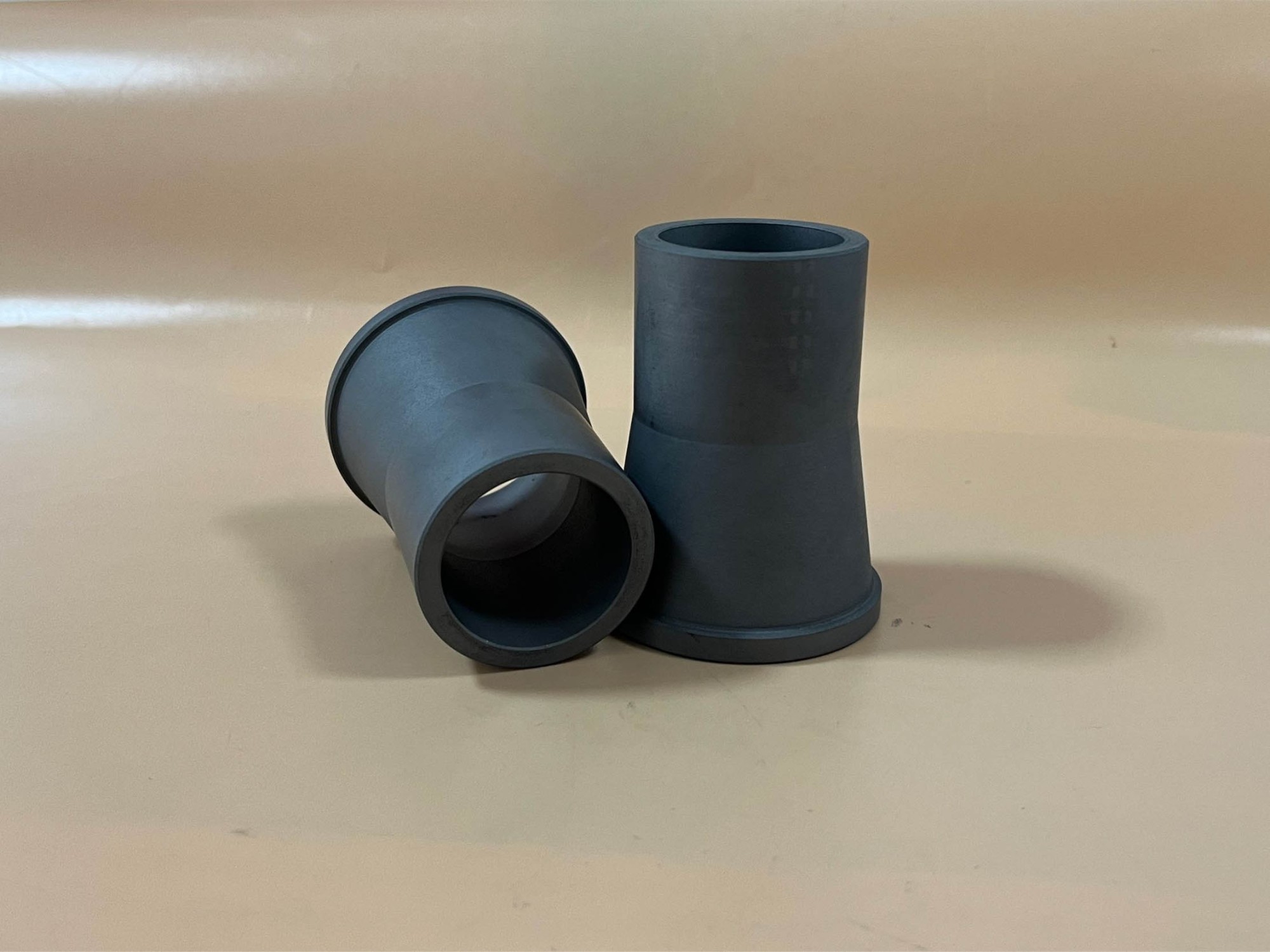 Wear and corrosion resistant ceramic reducer/nozzle/cyclone sleeve and tube in alpha sintered silicon carbide