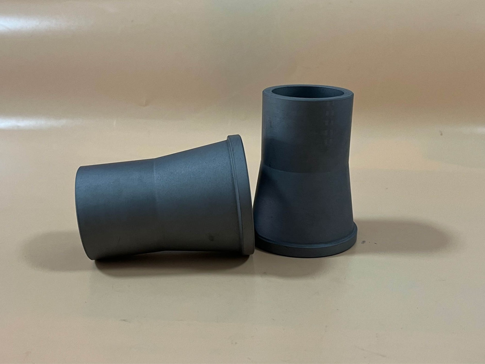 Wear and corrosion resistant ceramic reducer/nozzle/cyclone sleeve and tube in alpha sintered silicon carbide